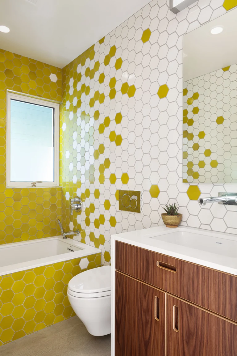 bernal heights san francisco modern sustainable remodel bathroom tile heath creative random yellow white drop in bathtub concrete floor wall mount toilet copy 768x1152