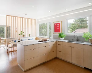 diamond heights eichler san francisco mid century modern sustainable remodel kitchen counter quartz solid surface cork flooring wood slat screen banquette breakfast bar copy 300x240
