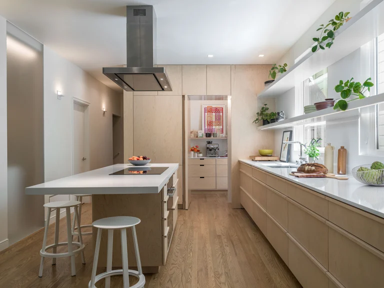 liberty street san francisco modern minimalist remodel kitchen island cantilever white quartz counter whitewashed maple cabinets white floating shelving over window hidden pantry 5 copy 768x576