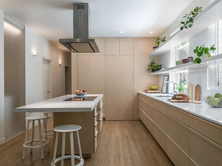 liberty street san francisco modern minimalist remodel kitchen island cantilever white quartz counter whitewashed maple cabinets white floating shelving over window hidden pantry 6 copy 768x576